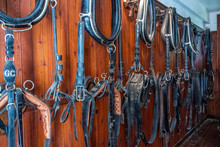 Equestrian Gear On Display In The Stable Of Medieval Castle In France.