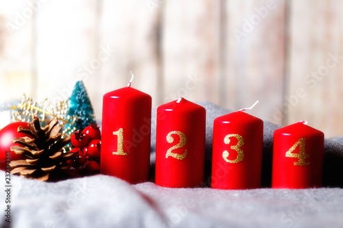 Four Advent Candles With Numbers And Christmas Decoration Baubles Little Christmas Tree And Cone On Soft Blanket Wooden Wall Buy This Stock Photo And Explore Similar Images At Adobe Stock