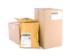 Wall Mural - Padded envelopes and cardboard parcels on white background