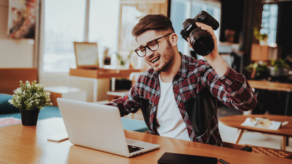 nervous guy throws camera while working remotely