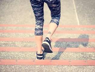 Wall Mural - Woman walking down the stair