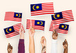 © Rawpixel.com - Hands waving flags of Malaysia