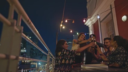 Wall Mural - Travelers meet up at rooftop party