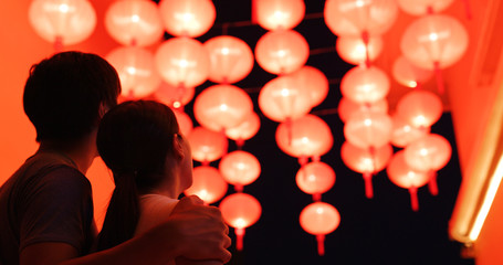 Couple enjoy the red chinese lantern