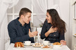 © soleg - romantic couple drinking tea with cookies and talking