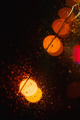 Poster - Black abstract background with bright colorful round bokeh