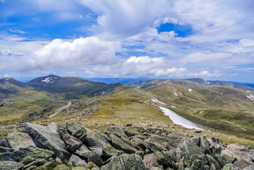 Spectacular panoramic view over rugged mountains from Mount Kosciuszko summit in the Snowy Mountains, New South Wales, Australia