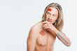 © LIGHTFIELD STUDIOS - nude handsome man with bloody wounds on skin isolated on white
