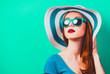 © Masson - style redhead girl with makeup in blue hat and sunglasses on green background isolaed