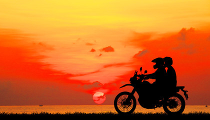 Wall Mural - silhouette of love in sunset with classic motorcycle