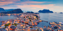 From The Bird's Eye View Of Alesund Port Town On The West Coast Of Norway, At The Entrance To The Geirangerfjord. Colorful Sunset In The Nord. Traveling Concept Background.
