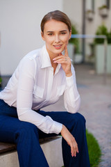 Wall Mural - Portrait, young business blonde in white shirt on summer street city