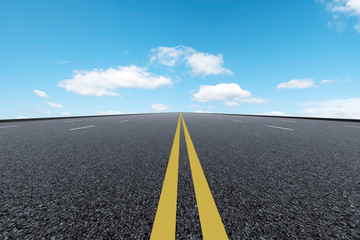 Empty highway asphalt pavement and sky cloud landscape..