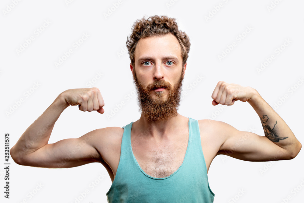 A funny mature bearded attractive guy with skinny torso, posing isolated over white studio background with raised folded hands - obrazy, fototapety, plakaty 