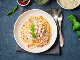 Wall Mural - Carbonara pasta. Spaghetti with pancetta, egg, parmesan cheese and cream sauce. Traditional italian cuisine. Top view