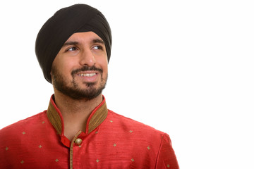 Poster - Young happy Indian Sikh thinking while wearing traditional cloth