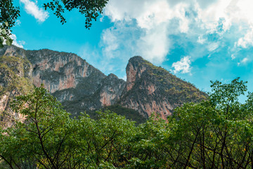 Wall Mural - Panoramic view of mountains on blue sky