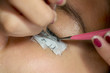 © Creativa Images - Woman eyes during eyelash extension