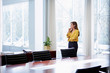 © Stocksy - Thoughtful Businesswoman Standing By Window