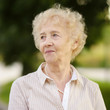 © Maria Sbytova - Outdoors portrait of beautiful smiling senior woman with curly white hair