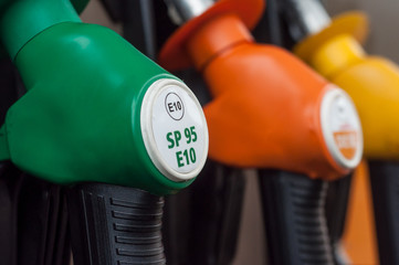 closeup of gas pistols in gas Station