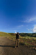 Landscape Photographer In The Painted Hills Of Oregon