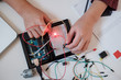 © Stocksy - Boy working on an electronic DIY kit at home