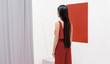 © Stocksy - Asian fashionable female model with long hair in red in abstract space ./Fashion series