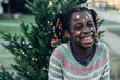 © Stocksy - Laughing black girl with star stickers on her face