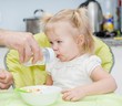 © Ermolaev Alexandr - Father gives daughter drink water bottles