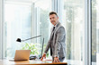 © Stocksy - Portrait Of Businessman Standing At Office Desk