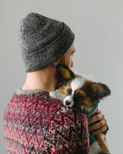 Man In Hat Holding Funny Dog