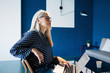 © Stocksy - Senior businesswoman working on laptop at office.