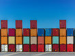 © Stocksy - Stacked cargo containers in storage area of freight sea port terminal