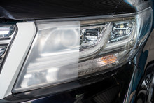 Car Headlights With Power Buffer Machine At Service Station - A Series Of CAR CARE Images.