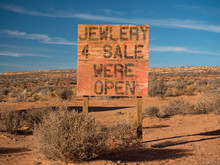 Misspelled Sign On The Side Of The Road Advertising Jewelry For Sale.
