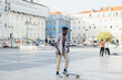 © Stocksy - Young men skating at square, Lisbon, Portugal