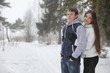 © alexkich - pair of lovers on a date winter afternoon in a snow blizzard