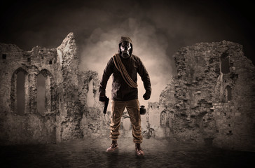 Wall Mural - Hazard, menace man in a ruined crumbly building with arms on his hand
