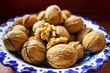 © slunicko24 - Walnuts in blue bowl.