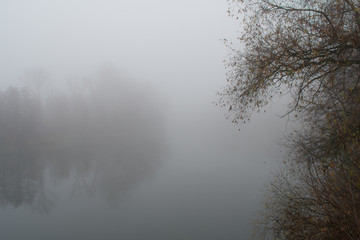   Foggy condition of the autumn November weather on the river
