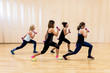 © Stocksy - Senior women working out in gym with her instructor