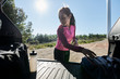 © Stocksy - Sportive woman after workout in car