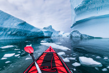 Kayaking In Antarctica Between Icebergs With Inflatable Kayak, Extreme Adventure In Antarctic Peninsula , Beautiful Pristine Landscape, Sea Water Paddling Activity