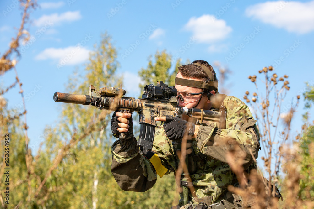 special forces, soldier assault rifle with silencer, optical sight ...