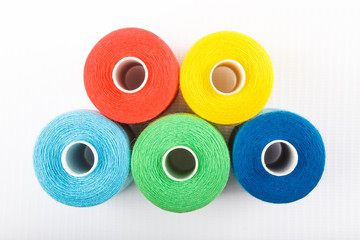 Wall Mural - Red, yellow, blue and green thread spools