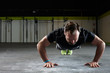 © Stocksy - Mature male exercising push ups in a gym or fitness club