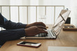 © Stocksy - Young Businessman Working On Laptop At The Office