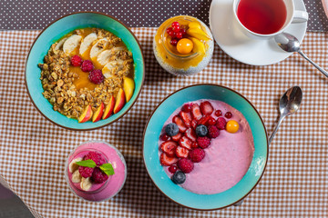 Porridge of muesli with fruit. Fresh fruit in porridge. Muesli with fruits. Muesli with fruit puree.