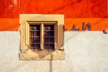 Retro background of an Italian building painted in orange and white